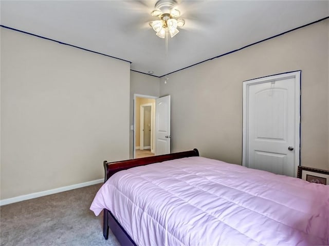 carpeted bedroom featuring baseboards and ceiling fan