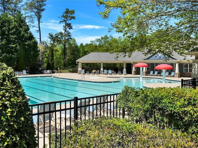 community pool featuring a patio area