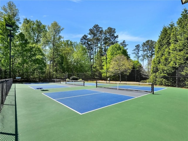 view of sport court with community basketball court and fence