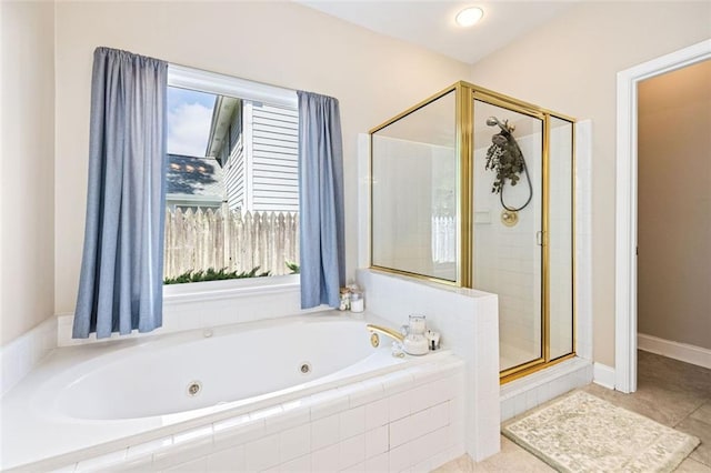 3072 Oaktree Ln, Duluth, GA 30096 - bathroom featuring a shower stall, a jetted tub, plenty of natural light, and tile patterned flooring