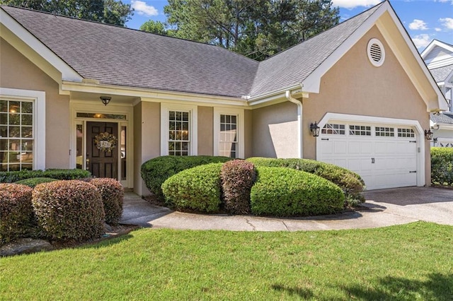 3072 Oaktree Ln, Duluth, GA 30096 - view of front facade with an attached garage, driveway, stucco siding, and roof with shingles