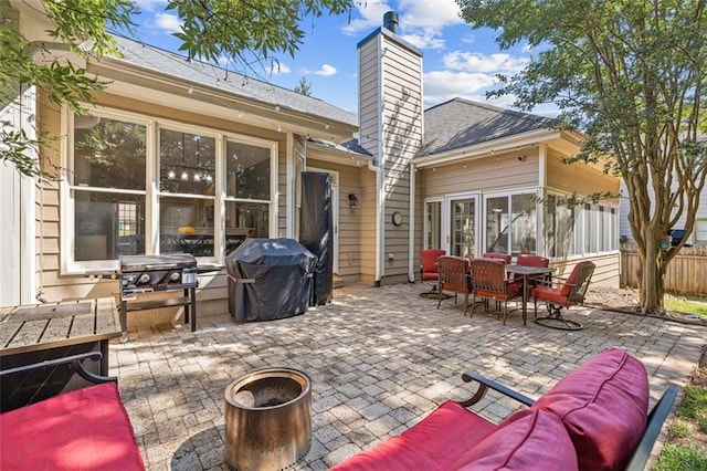 3072 Oaktree Ln, Duluth, GA 30096 - view of patio featuring a grill and outdoor dining area