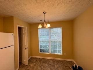 unfurnished dining area with a chandelier