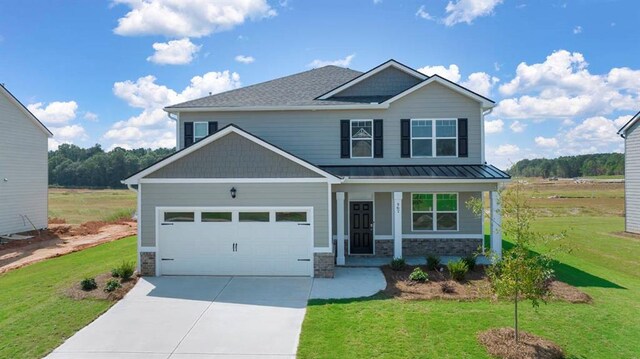 craftsman inspired home featuring a front yard and a porch