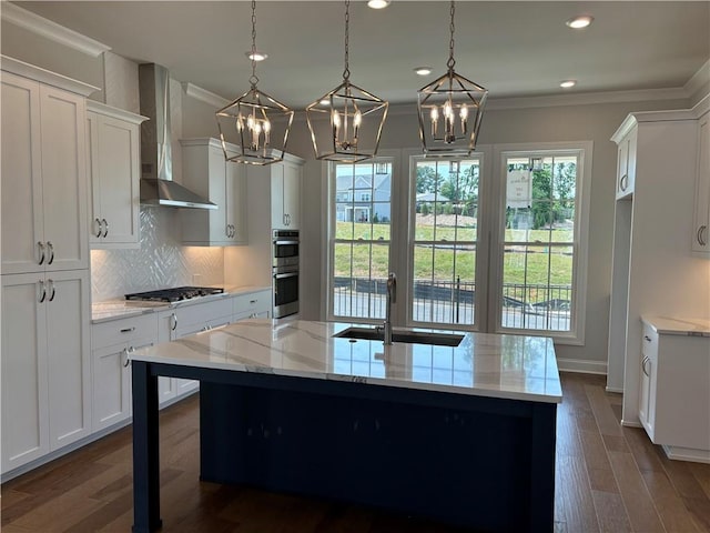 173 Basil St, Cumming, GA 30040 - kitchen featuring wall chimney range hood, a chandelier, a sink, appliances with stainless steel finishes, and backsplash