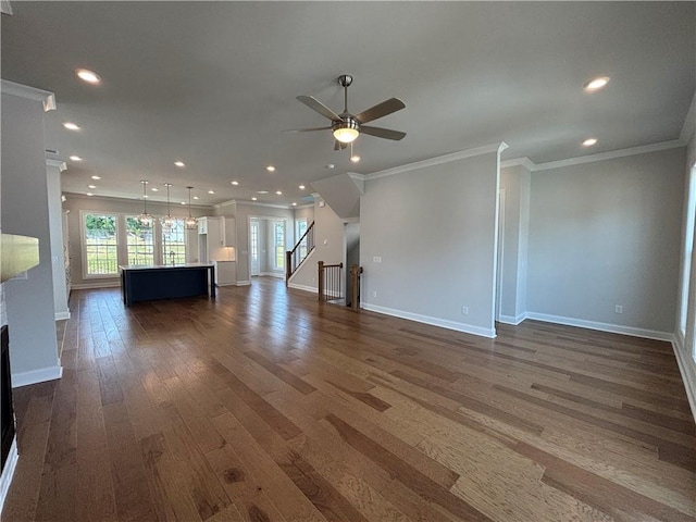 173 Basil St, Cumming, GA 30040 - unfurnished living room featuring ornamental molding, dark wood finished floors, plenty of natural light, baseboards, and recessed lighting