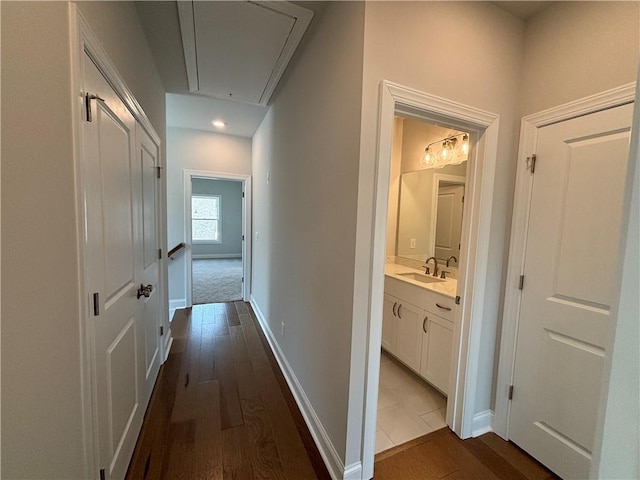 173 Basil St, Cumming, GA 30040 - hallway with attic access, dark wood finished floors, a sink, baseboards, and recessed lighting