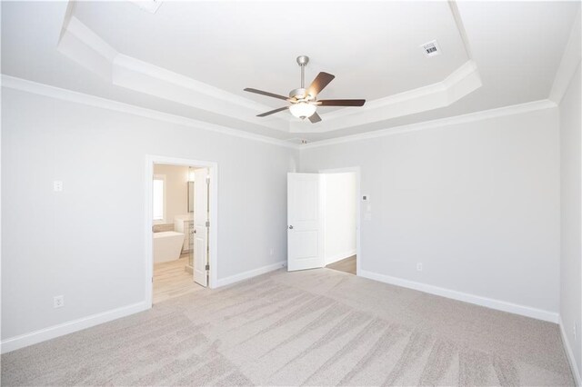 173 Basil St, Cumming, GA 30040 - unfurnished bedroom featuring a raised ceiling, light carpet, ornamental molding, baseboards, and ensuite bathroom