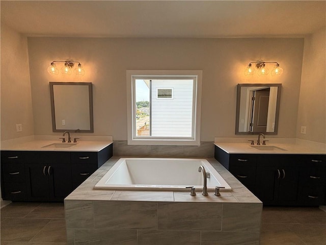 173 Basil St, Cumming, GA 30040 - full bath featuring tile patterned floors, two vanities, and a garden tub