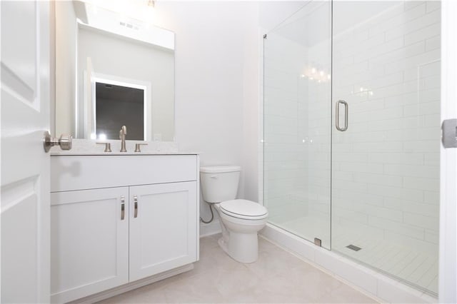 173 Basil St, Cumming, GA 30040 - bathroom with vanity, toilet, a shower stall, baseboards, and tile patterned flooring
