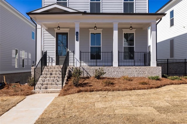 173 Basil St, Cumming, GA 30040 - doorway to property featuring covered porch