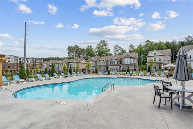 173 Basil St, Cumming, GA 30040 - community pool featuring a residential view and a patio