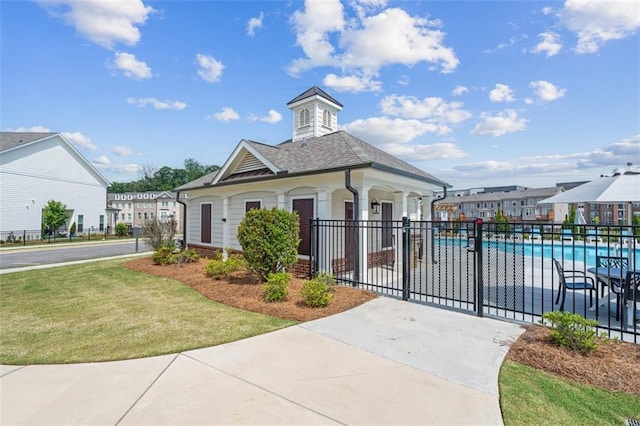173 Basil St, Cumming, GA 30040 - view of building exterior with a community pool