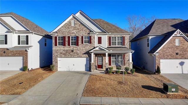 view of front of house featuring driveway and brick siding