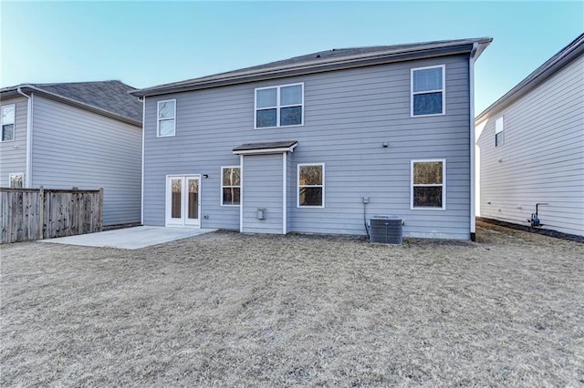 back of property with a patio, fence, and central AC unit