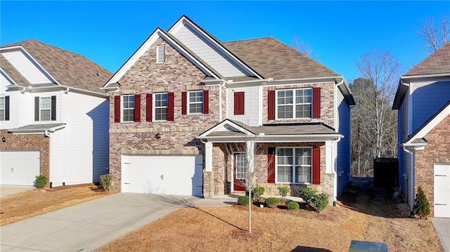 view of front of house featuring a garage, brick siding, and driveway