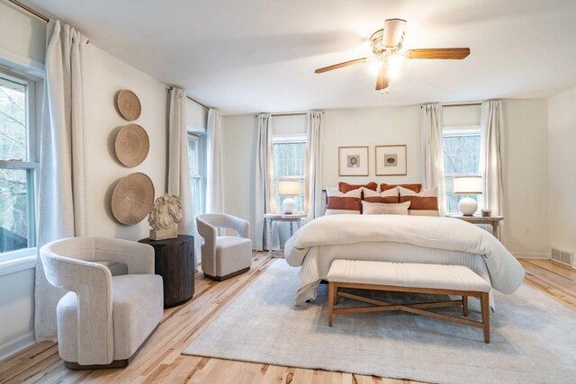 bedroom featuring ceiling fan and light hardwood / wood-style flooring