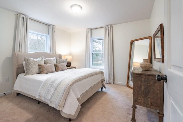 bedroom with light colored carpet