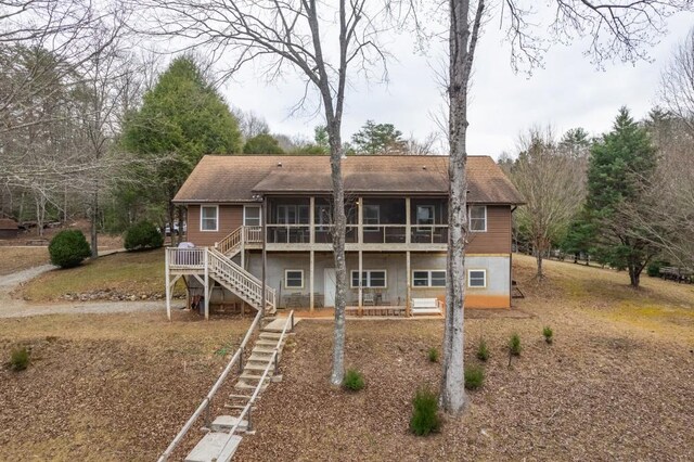 rear view of house with a sunroom