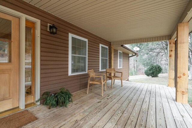 wooden deck featuring covered porch