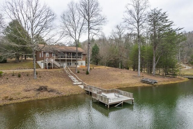 view of dock featuring a deck with water view