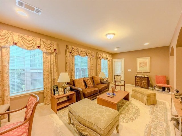 6416 Hickory Springs Cir, Hoschton, GA 30548 - carpeted living area featuring baseboards and arched walkways