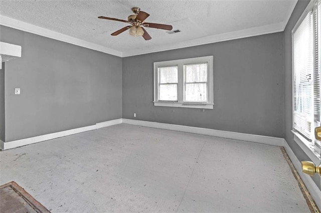 empty room featuring ceiling fan and a textured ceiling