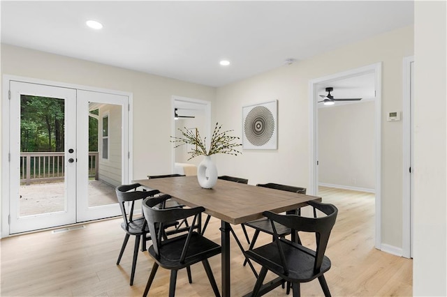 dining room featuring ceiling fan, light wood-type flooring, and french doors