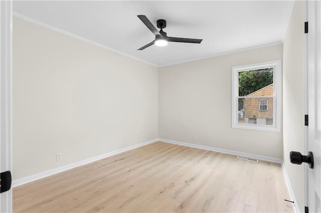 empty room with crown molding, ceiling fan, and light hardwood / wood-style floors