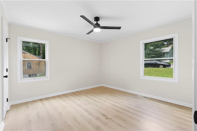 spare room featuring ceiling fan, crown molding, and light hardwood / wood-style flooring