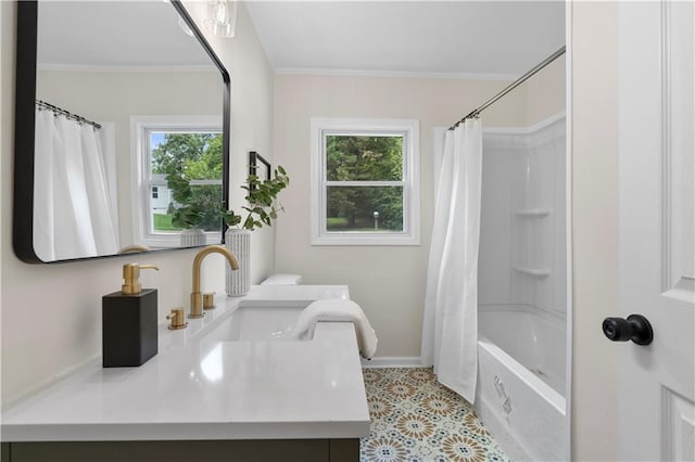 bathroom with shower / tub combo with curtain, vanity, a healthy amount of sunlight, and ornamental molding