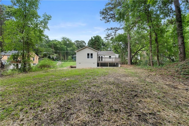 view of yard featuring a wooden deck