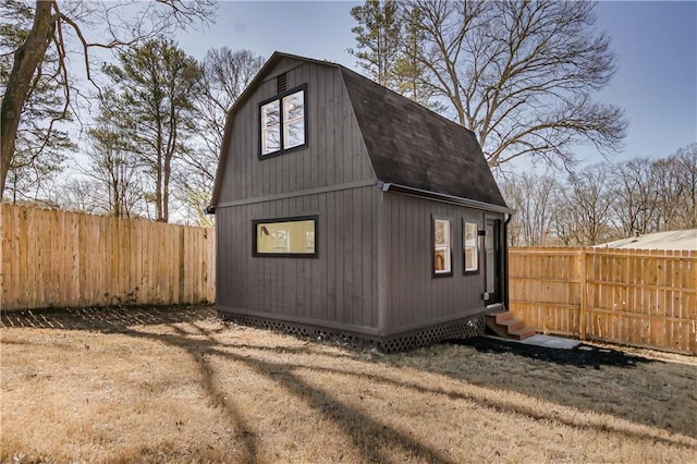 view of outdoor structure with a lawn