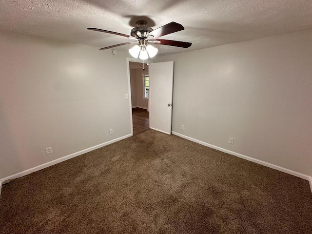 1095 S Burnt Hickory Rd, Douglasville, GA 30134 - unfurnished room featuring a ceiling fan, dark carpet, baseboards, and a textured ceiling