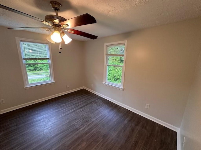 1095 S Burnt Hickory Rd, Douglasville, GA 30134 - empty room with dark wood finished floors, baseboards, and a textured ceiling