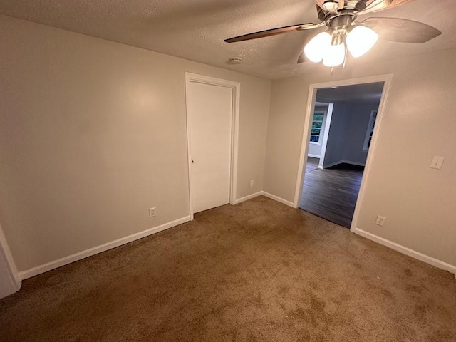 1095 S Burnt Hickory Rd, Douglasville, GA 30134 - spare room featuring a ceiling fan, carpet floors, a textured ceiling, baseboards, and a smoke detector