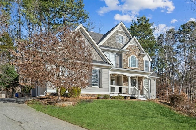 view of front facade with a porch and a front yard