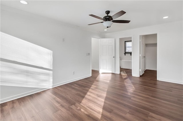 unfurnished bedroom with recessed lighting, dark wood-style flooring, a ceiling fan, baseboards, and crown molding