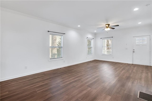 unfurnished living room with recessed lighting, dark wood-style flooring, a ceiling fan, baseboards, and visible vents