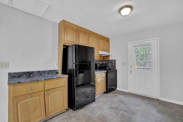 kitchen featuring black appliances, under cabinet range hood, a textured ceiling, baseboards, and dark countertops