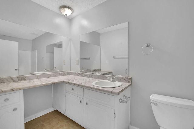 full bathroom with toilet and vanity