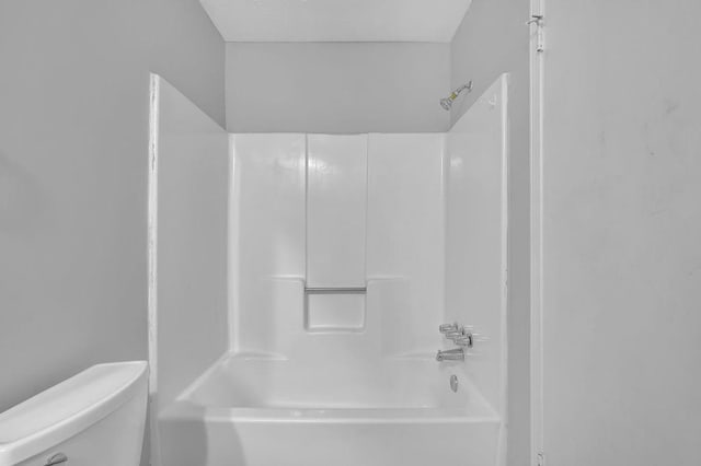 full bathroom featuring toilet and bathing tub / shower combination