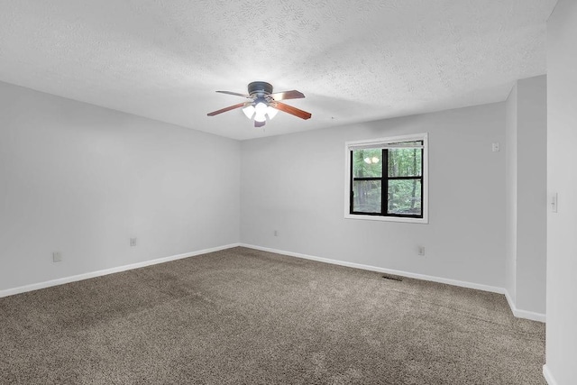 unfurnished room featuring ceiling fan, a textured ceiling, carpet, and baseboards