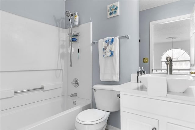 bathroom with washtub / shower combination, a textured ceiling, vanity, and toilet