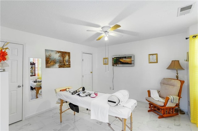 dining room with baseboards, visible vents, ceiling fan, a textured ceiling, and marble finish floor