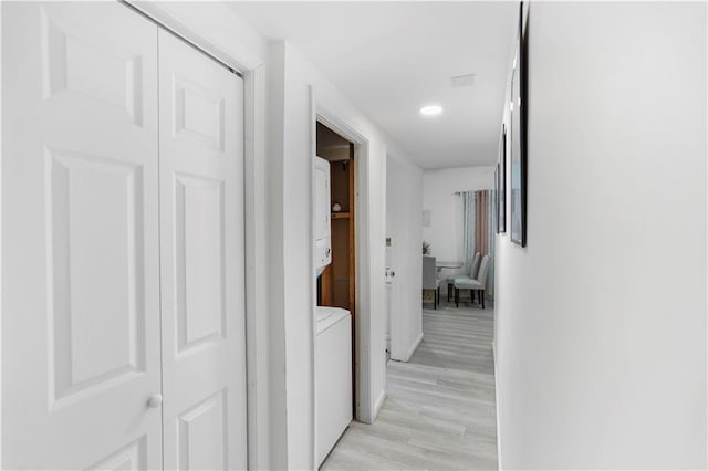 hallway with recessed lighting and light wood-style floors