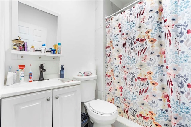 bathroom featuring vanity, toilet, and a shower with shower curtain