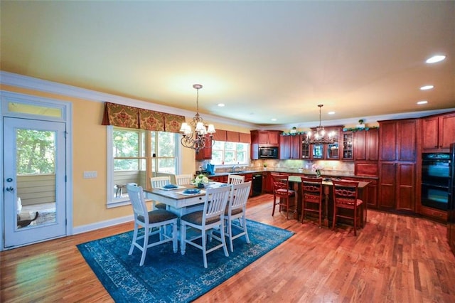 3423 Mulberry Lane Ct, Dacula, GA 30019 - dining space featuring a chandelier, wood finished floors, ornamental molding, and recessed lighting