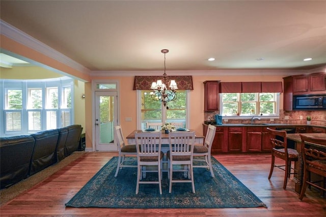 3423 Mulberry Lane Ct, Dacula, GA 30019 - dining area with a chandelier, crown molding, dark wood-style flooring, and recessed lighting