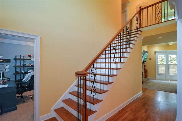 3423 Mulberry Lane Ct, Dacula, GA 30019 - stairway featuring a towering ceiling, wood finished floors, and carpet